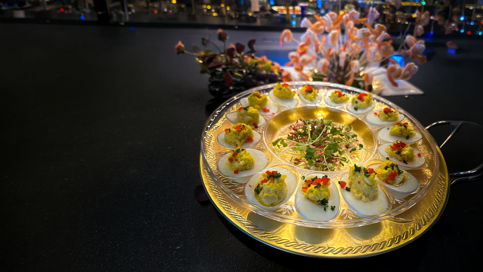 Caviar deviled eggs on a gold tray